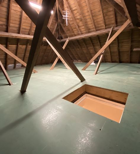 Loft boarding and flooring installation showing raised platform system